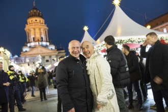 Kai Wegner, Governing Mayor of Berlin, together with an artist in front of the German Cathedral at