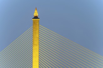 The illuminated Rama VIII Bridge, a cable-stayed bridge across Mae Nam Chao Praya, Bangkok,