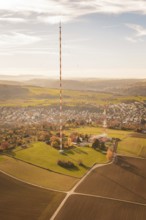 The transmission tower towers over a vast landscape with fields and villages, MÃ¼hlacker, Enzkreis,