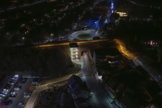 Nocturnal image of an illuminated street with bridge and buildings, Nagold, Calw district, Germany
