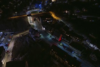 Dark street view with scattered lights and modern buildings, Nagold, Calw district, Germany