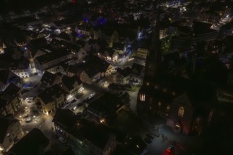 Night view with illuminated church and surrounding buildings, Nagold, Calw district, Germany
