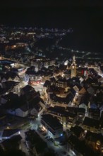Panoramic view of a city at night with a brightly lit church tower, Nagold, Calw district, Germany