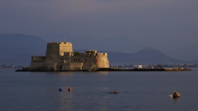 Bourtzi island fortress, rocky fortress on a small island in sunset light, Nauplion, Nafplion,