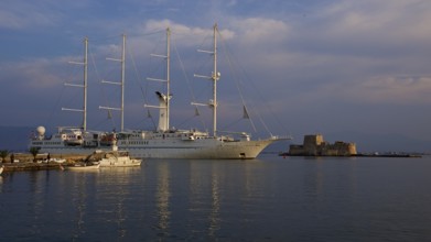 Port of Nauplion, Bourtzi island fortress, A large sailing ship in the harbor next to smaller boats