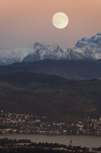 View from Horben of Lake Zug with the town of Cham and Zug, behind it the snow-capped mountains