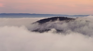 View of the Gisliflue on a Jura foothill covered in fog in the light morning light, Talheim,