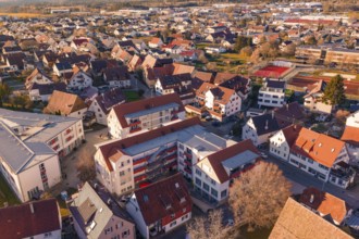 Bird's eye view of a residential area with various terraced houses and multi-storey buildings,