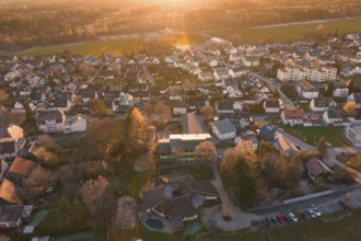 Large residential area in autumn light with many houses and nature seen from the air, Althengstett,