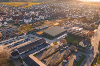 Village visible from above with sunset, roofs and surrounding landscape, Althengstett sports center