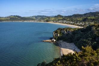 Landscape with sea and sandy beach in New Zealand. View of Lonely Bay and Cooks Beach from