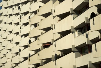 High-rise apartment building with balconies and satellite dishes, satellite town of Chorweiler in