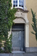 Stucco decoration above the entrance to Johanneum, built in 1905, near St. Johannis 1-3, Hanseatic