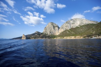 Picturesque rocky coast, cliffs with Pedra Longa pinnacle, blue sea, Golfo di Orosei, Baunei,