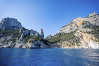 Picturesque rocky coast, cliffs with L'Aguglia pinnacle, blue sea and Cala GoloritzÃ© beach, Golfo