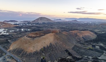 Picturesque volcanic landscape with volcanic craters MontaÃ±a de la Tabaiba at sunrise, Parque