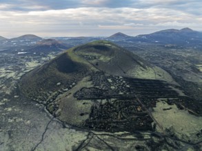 MontaÃ±a Negra volcano, picturesque volcanic landscape with volcanic crater at sunrise, Parque