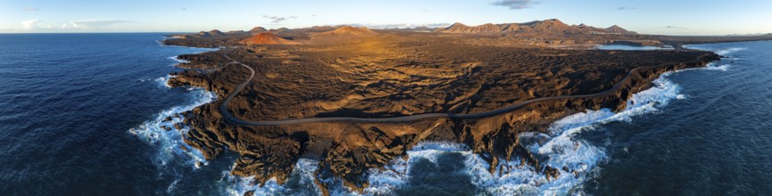 Coast with lava fields, volcanic landscape near Los Hervideros with red volcano MontaÃ±a Bermeja,