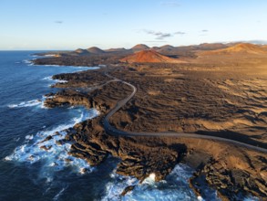 Coast with lava fields, volcanic landscape near Los Hervideros, in the evening light, aerial view,