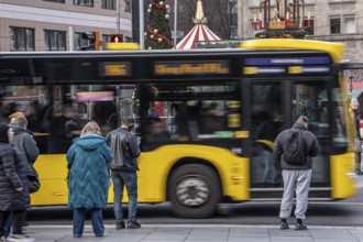 Bus station at Essen main station, Ruhrbahn bus leaves, passers-by wait, Essen, North