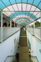 People using an underground passage protected by a veranda, Kandy, Sri Lanka