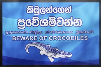 Signpost announcing Beware of crocodiles, Anuradhapura, Sri Lanka