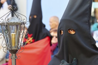 Good Friday procession, religious procession with participants in black robes, UNESCO World