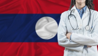 Medical professional on Laos flag. Healthcare and wellness in Laos, Concept
