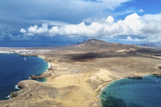 Headland and blue sea, coastal landscape, arid landscape of Los Ajaches Natural Park, aerial view,