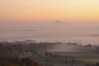 Hohenstaufen in the golden morning light, Aichelberg. Spectacular dawn over the foggy foothills of