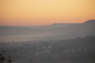 Morning atmosphere on Aichelberg View over the foggy foothills of Alb, golden light over the sea of