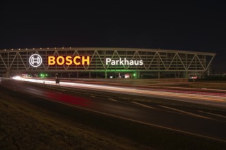 Night view of the A8 with traces of light at the P20 Messe car park, Airport, Stuttgart Germany