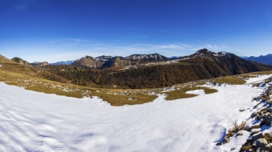 Snowfield on the Trattberg Alm with a view of the Osterhorn Group, Salzkammergut, Salzburg, Austria