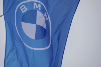 Flag with BMW logo on a car dealership