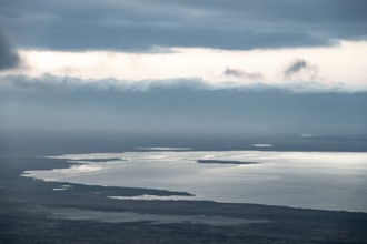View of savanna landscape and Magadi Lake with clouds, view of Ngorongoro Crater, Ngorongoro