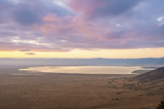 View of savanna landscape and Magadi Lake at sunrise, atmospheric morning light, view of Ngorongoro