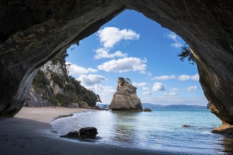 Cathedral Cove in New Zealand. Sea, sandy beach and limestone cliffs. The cave itself overlooks Te