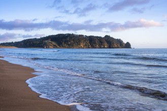 Landscape with sea and sandy beach in New Zealand. Hot Water Beach, Coromandel Peninsula, Waikato,