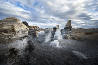 Eroded rock formations, volcanic landscape with dramatic cloudy skies, Ciudad Estratificada or Los