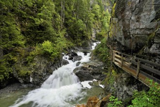 Wooden walkway next to the Diosaz mountain river in the gorge, Gorges de la Diosaz, Les Houches,