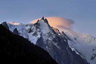 Aiguille du Midi with sun-lit cloud above the summit, Mont-Blanc, Chamonix-Mont-Blanc,