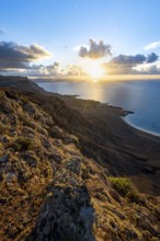 View of steep cliffs on sea and coast, Mirador del Porrito viewpoint at sunset, Lanzarote, Canary