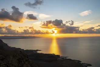 View of steep cliffs on sea and coast, Mirador del Porrito viewpoint at sunset, Lanzarote, Canary