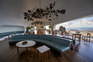 Sitting area with large sofa in the cafe with panoramic window, interior at the Mirador del RÃ­o