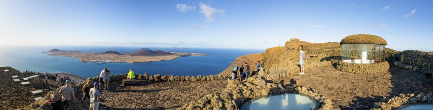 Stairway and tourists on the viewing platform at the Mirador del RÃ­o viewpoint, in the evening