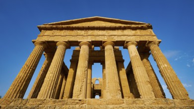Temple of Concordia, imposing ancient temple with classical columns against a clear sky, Valley of