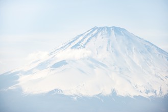 Snow-covered summit of Mount Fuji volcano in spring, ÅŒwakudani, Hakone, Japan