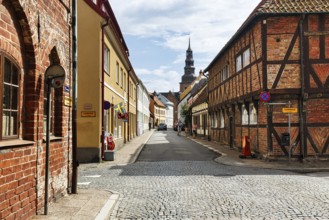 Charming cobblestone street, traditional half-timbered houses and brick buildings, St. Mary's