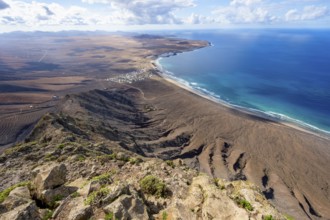 Castillejo viewpoint, view from the Risco de Famara cliffs to the coast and the sea with the Famara