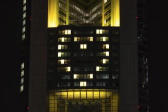 Lights inside the offices project a glowing yellow heart onto the faÃ§ade of the Commerbank Tower